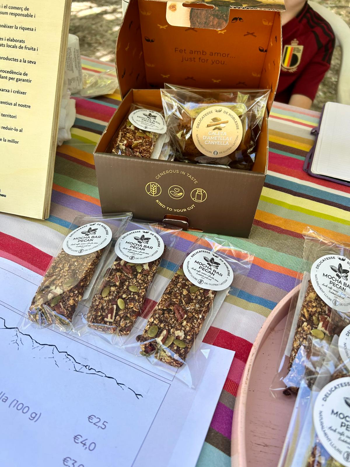 Open Delicatesse gift box with almond cinnamon cookies and Mocha Bars